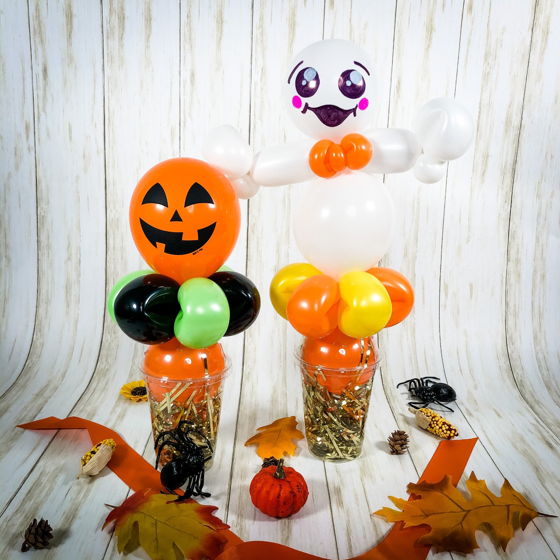 Halloween balloon treat holders by Whimsy Entertainment featuring a jack-o-lantern and friendly ghost.