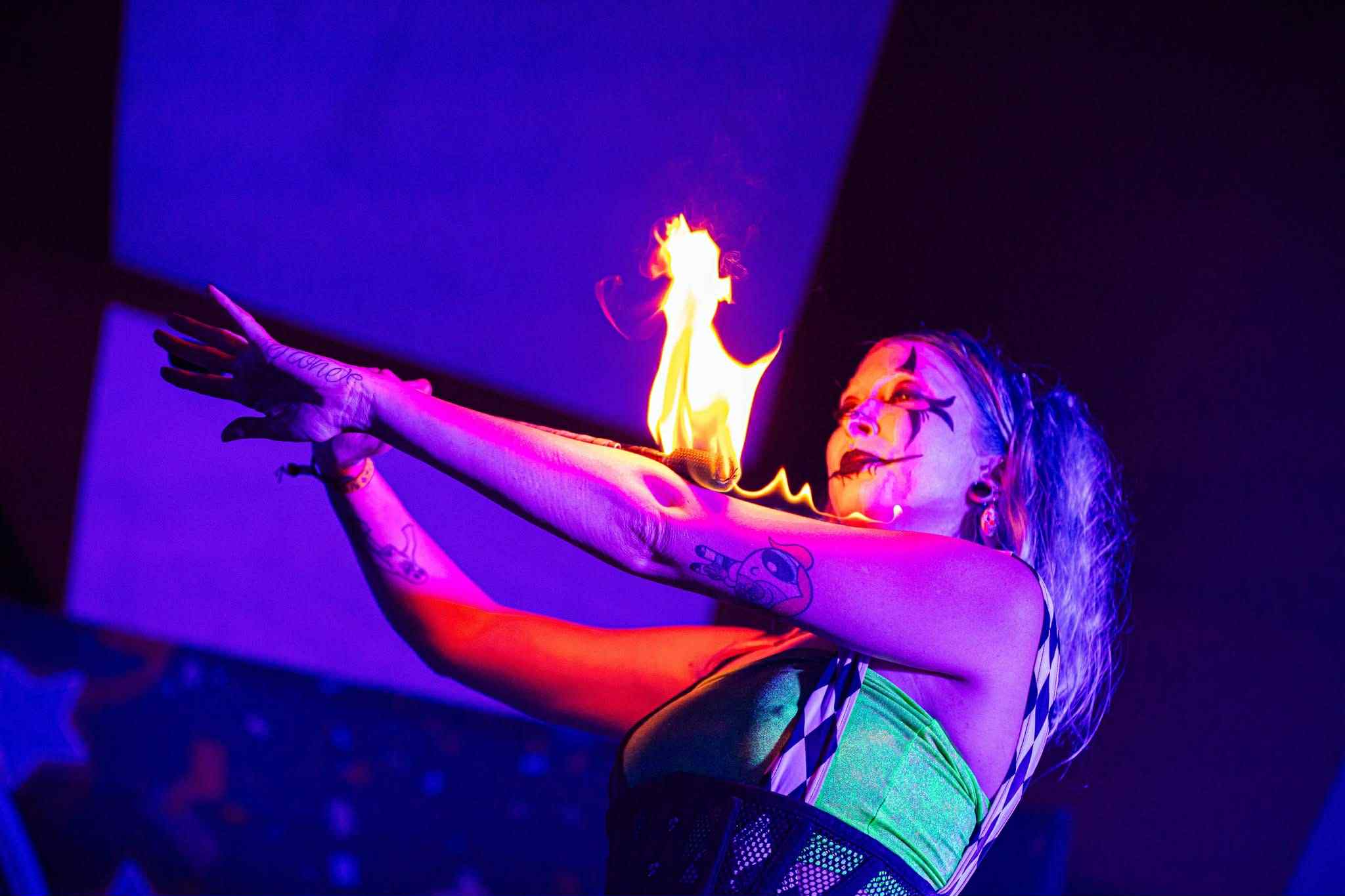 Circus sideshow act featuring the very dangerous Blockhead stunt, performed by Saria “Blu” Braska as part of a Whimsy Entertainment variety show for adults seeking unusual event entertainment.