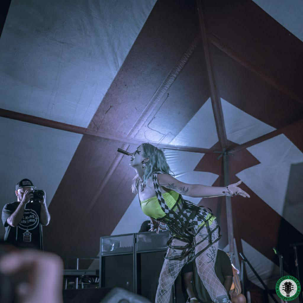 Whimsy Entertainment performing at a corporate event with a mix of playful clowning, light sideshow demonstrations and photo-friendly character moments to keep guests talking.