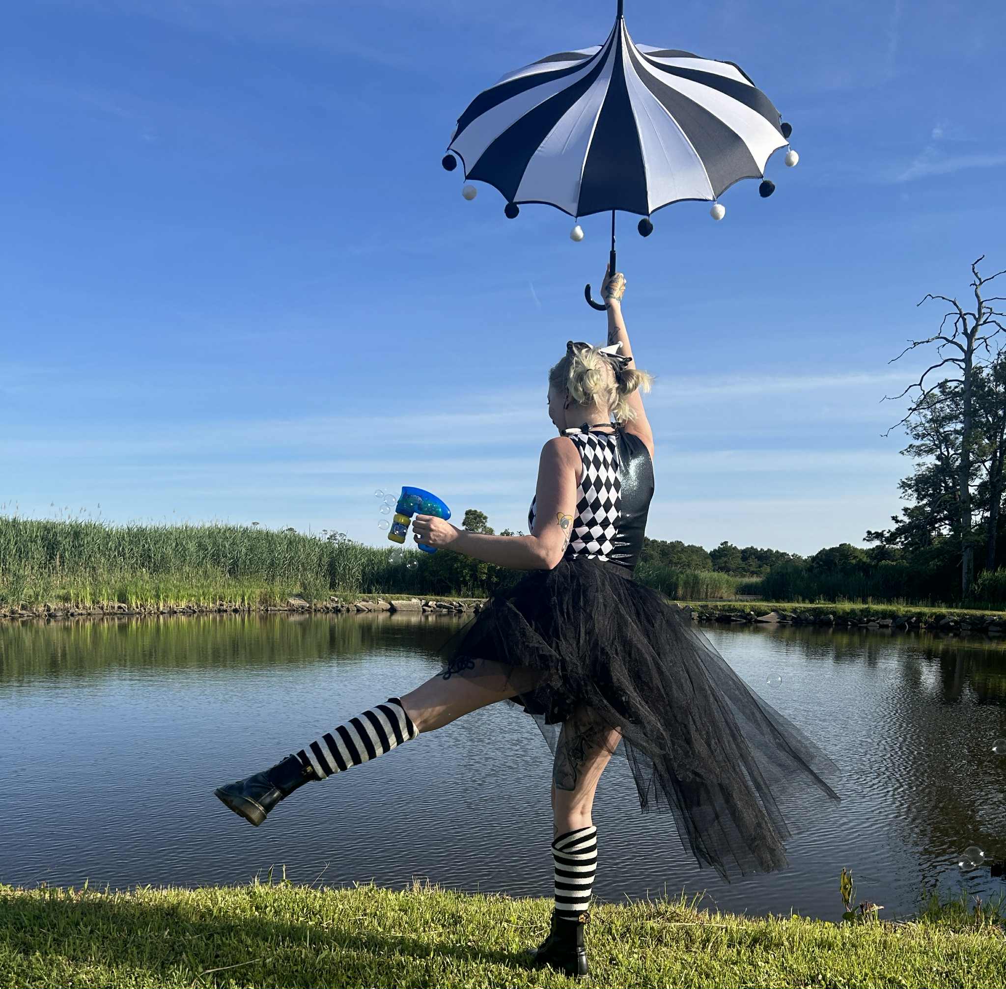 Face painting and glitter makeup by Whimsy Entertainment in Virginia, with Blu transforming kids into superheroes, animals and fantasy characters during a family-friendly party and community festival.