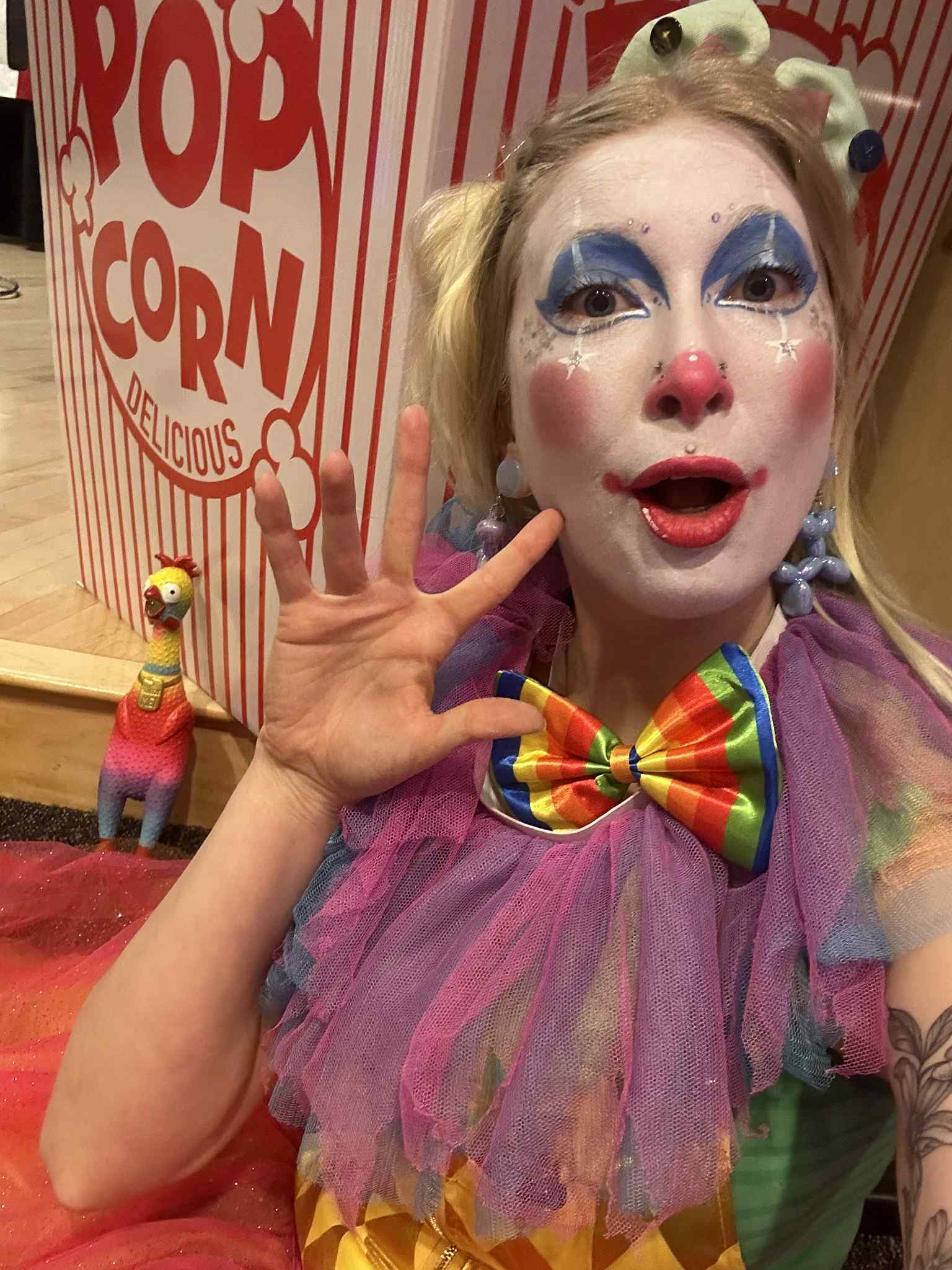 Whimsy Entertainment performing at a corporate event with a mix of playful clowning, light sideshow demonstrations and photo-friendly character moments to keep guests talking.