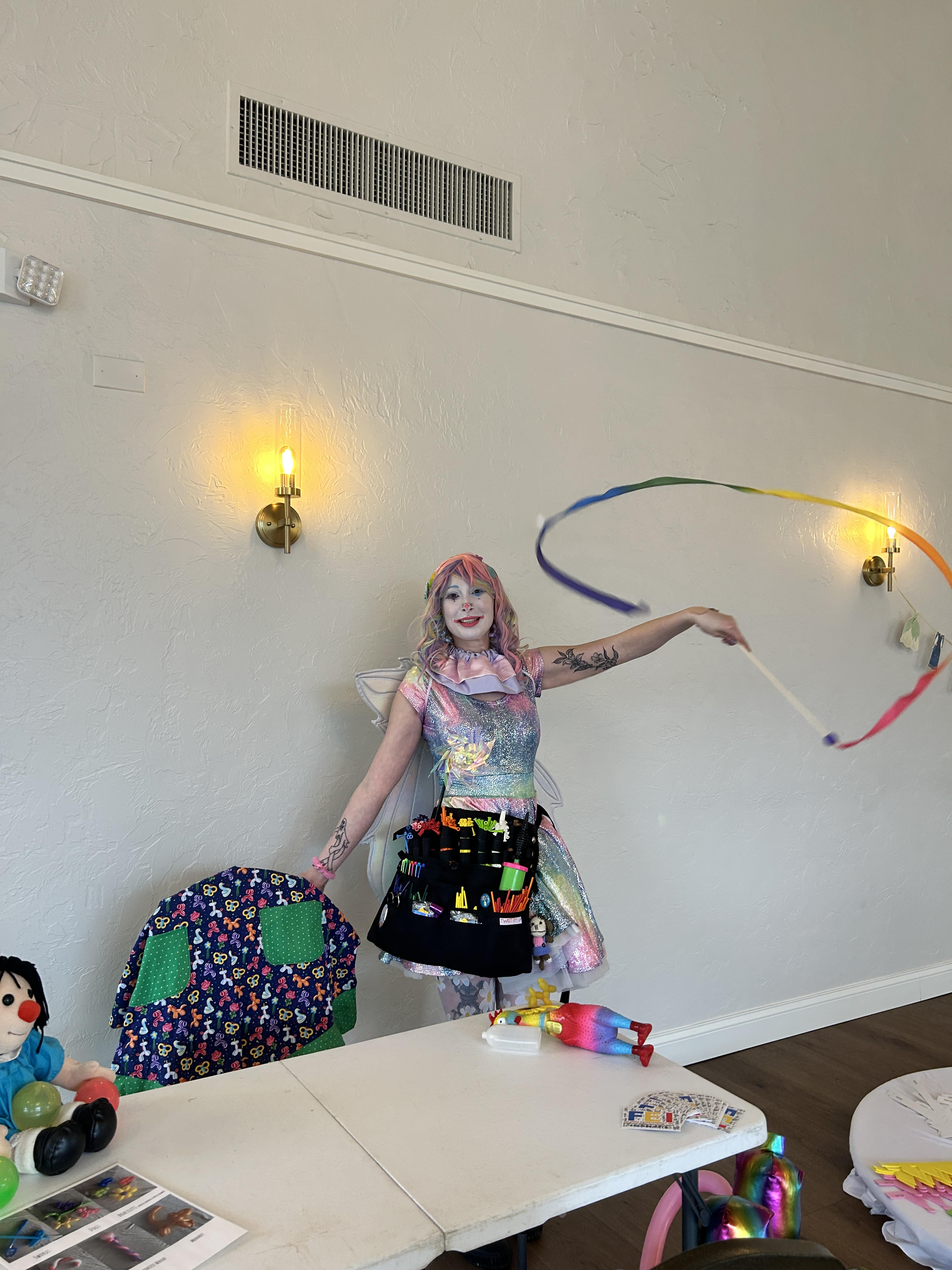 Whimsy Entertainment circus clown and party entertainer for Ohio (Cleveland area), Detroit and Pittsburgh posing with guests at an event with bright costumes and family-friendly circus vibes.